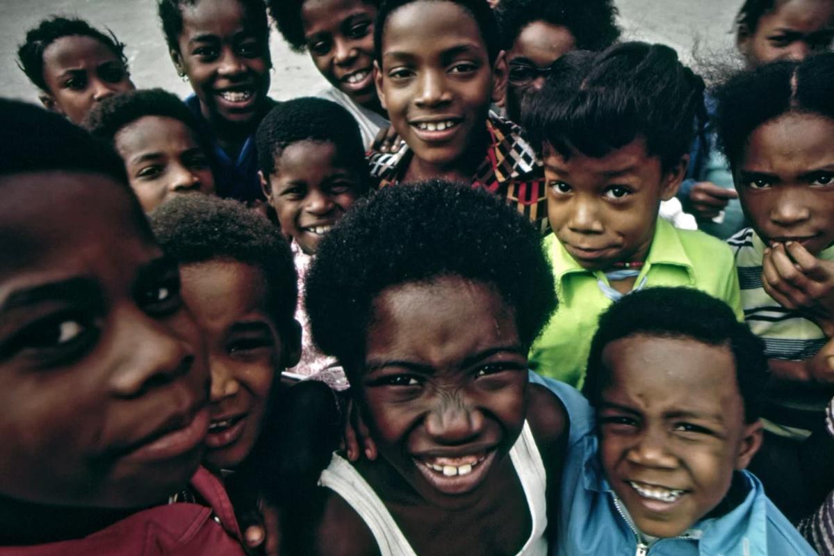 A group of children smiling together